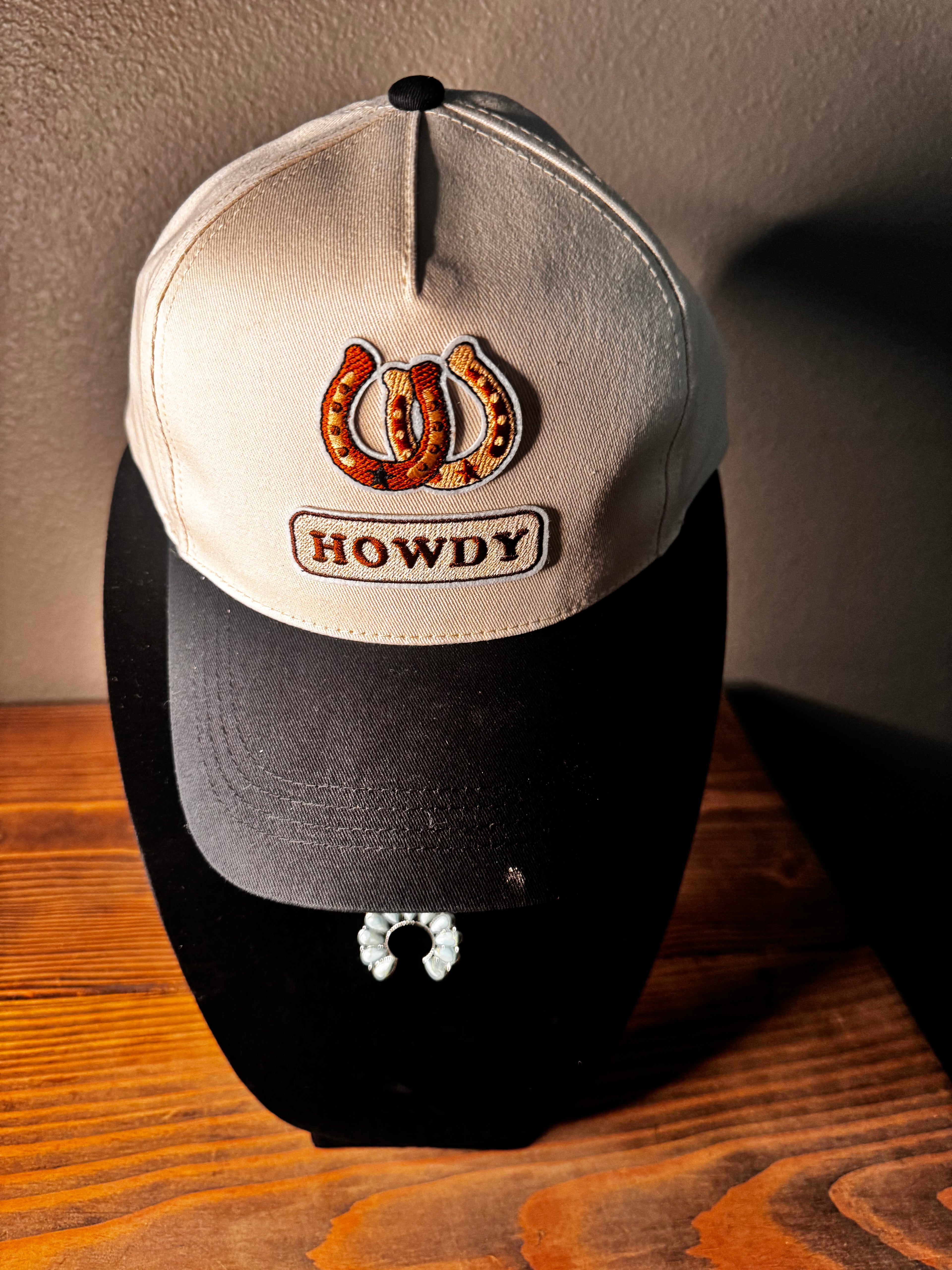 Beige and black hat